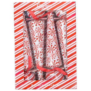 A box of eight Caspari Peppermint Crackers with red and white swirl designs and red ribbons, displayed in striped packaging with a clear window—festive surprises ideal for your next celebration.