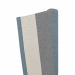 A close-up of the Magdalena York Lina Rug in Chalk, Dark Grey & James Blue, featuring folded vinyl fiber with vertical stripes against a white background.