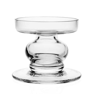 The Alexis Crystal Hurricane Shade and Large Candle Holder by William Yeoward Crystal features clear glass with a wide base, round stem, and shallow top bowl, photographed against a white background.