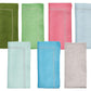The Kim Seybert Classic Napkin Set by Kim Seybert includes seven linen napkins in dark green, light green, pink, red, light turquoise, blue, and beige. Each features an embroidered border and is displayed in two neat rows on a white background.