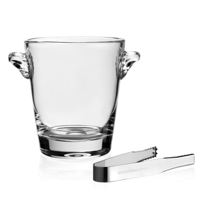 The William Yeoward Crystal Classic Ice Bucket features two side handles and includes a pair of metal ice tongs—an elegant wine cooler, handmade from crystal glass, displayed on a white background.
