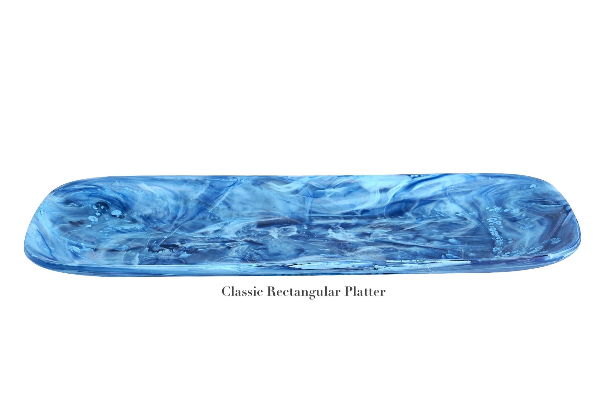 A blue, marbled rectangular platter with rounded edges from the Denim Resin Serveware Collection by Nashi Home, crafted from shatter-resistant resinware—an elegant touch for any home decor, shown on a white background.