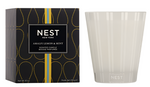 A box labeled "Nest Amalfi Lemon & Mint Collection" stands beside an empty frosted candle holder, evoking the refreshing essence of this collection inspired by the Amalfi Coast.