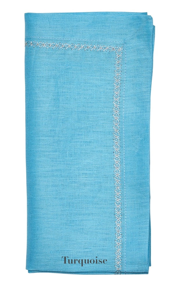The Kim Seybert Classic Napkin Set, by Kim Seybert, offers a soothing turquoise hue with an embroidered border, bringing elegance to any table setting.