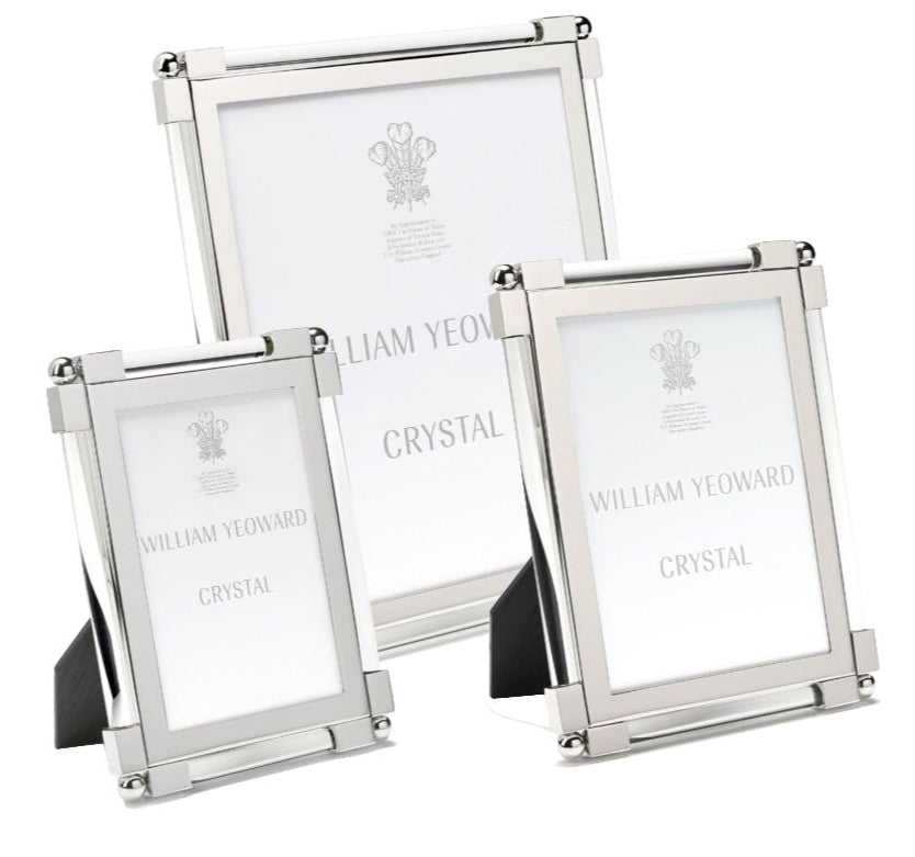 Three frames from the Clear Classic Frame Collection by William Yeoward Crystal, crafted with silver-toned glass and nickel-plated edges in varied sizes, display placeholders reading "William Yeoward Crystal.