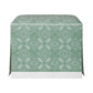 The Hickory Chair Cocktail Ottoman features a green and white patterned fabric cover with geometric and floral motifs, a dressmaker skirt for added elegance, and a white base trim. Made to measure for your unique space.
