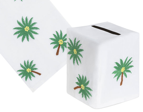 Haute Home's Coconut Tree Bath Collection in Green includes a tissue box with a hand-embroidered coconut tree design and matching tissue paper partially pulled out.