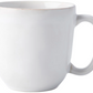 The Juliska Puro Whitewash Dinnerware Collection features a plain white ceramic mug with a handle, ideal for enjoying warm drinks or displaying teatime treats in elegant, neutral style.