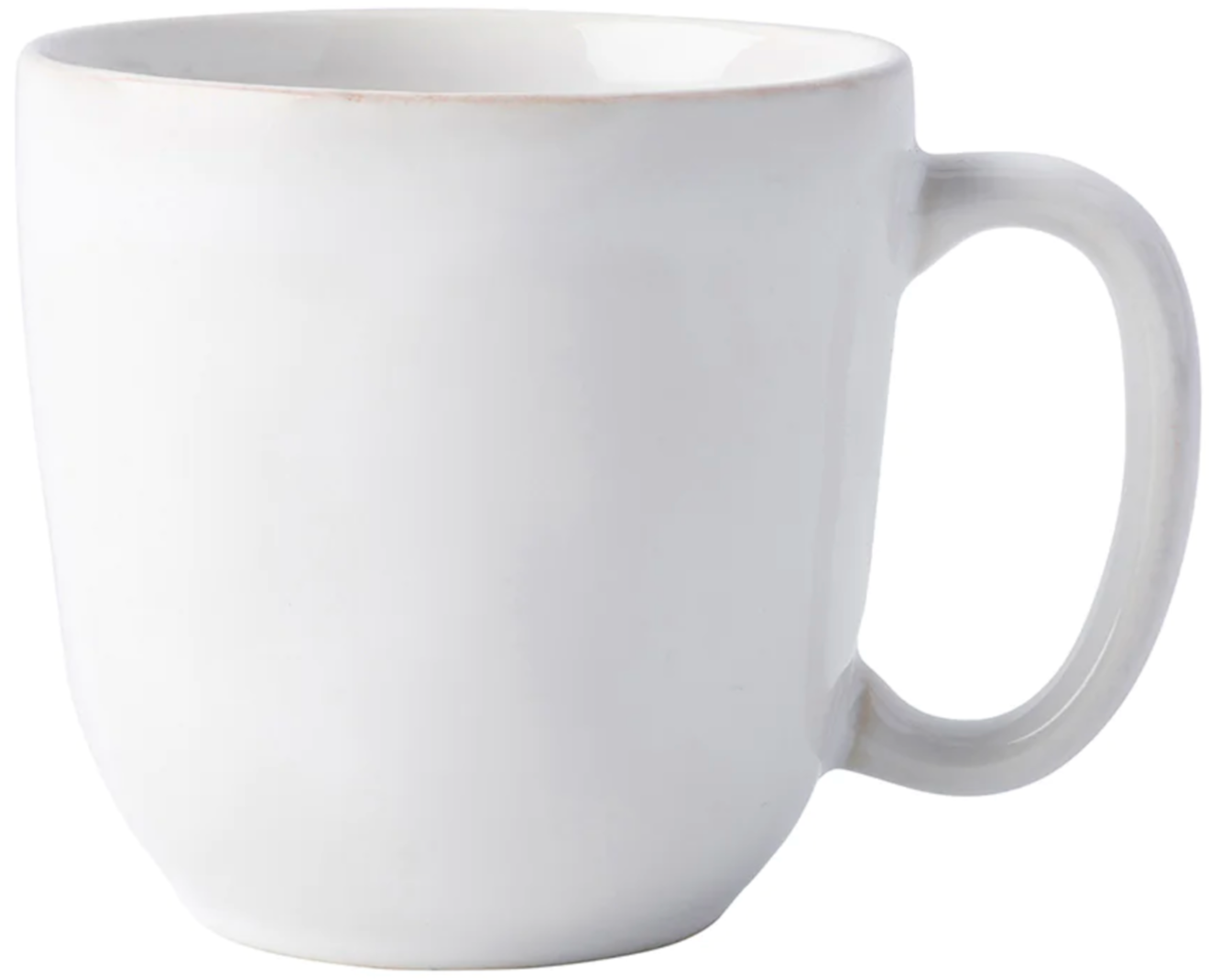 The Juliska Puro Whitewash Dinnerware Collection features a plain white ceramic mug with a handle, ideal for enjoying warm drinks or displaying teatime treats in elegant, neutral style.