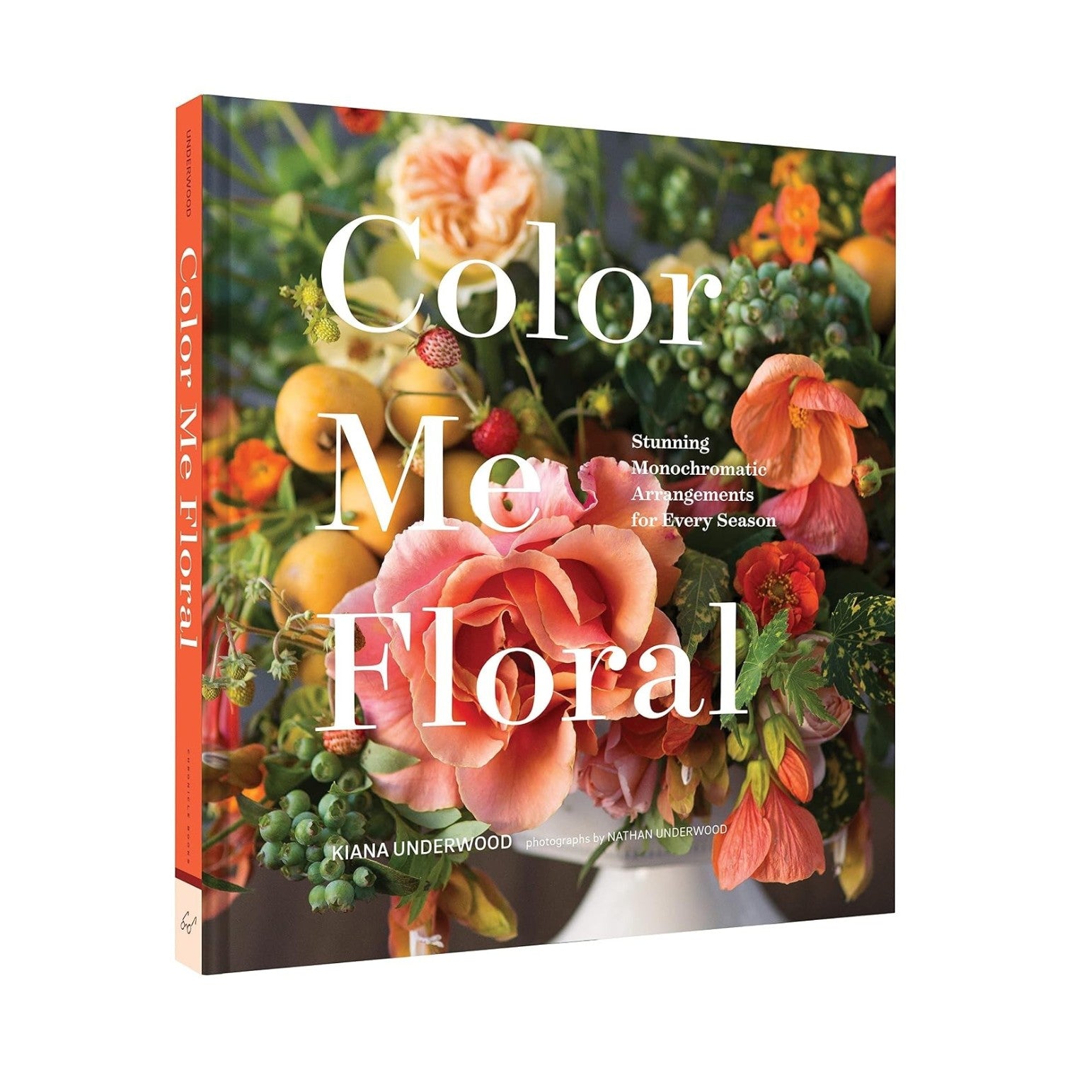 The cover of “Color Me Floral” from Chronicle Books features a vibrant floral arrangement set against a white background, capturing the book’s focus on stunning monochromatic blooms and inventive floral designs.