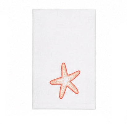 Introducing the Playful Starfish Bath Collection by Haute Home—a white hand towel made from premium linen, adorned with an embroidered orange starfish near the bottom center for an elegant accent to your home décor.
