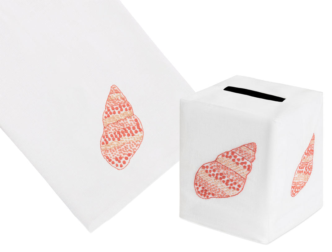Speckled Conch Coaster & Bath Collection by Haute Home includes a white towel and tissue box cover, each adorned with a printed red seashell design and crafted from premium linen for an elegant touch.