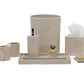 The Cordoba Bath Collection by Pigeon & Poodle features a beige ceramic design with burlap texture and includes a soap dispenser, tumbler, cotton jar, tissue box, tray, perfume bottle, and soap dish with soap.