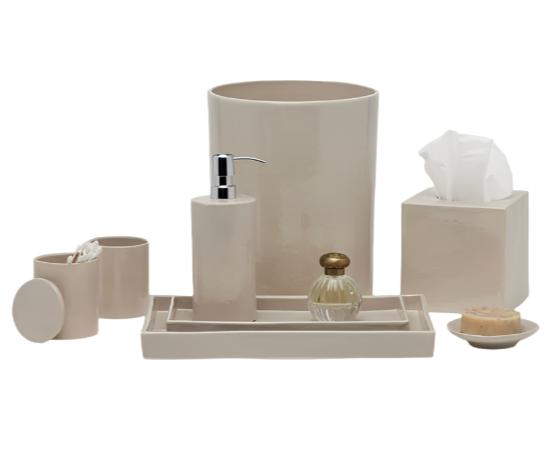 The Cordoba Bath Collection by Pigeon & Poodle features a beige ceramic design with burlap texture and includes a soap dispenser, tumbler, cotton jar, tissue box, tray, perfume bottle, and soap dish with soap.