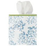 A Weezie Towels box featuring the elegant Meg Braff Cornflower pattern with a green top showcases white tissues partially pulled out.