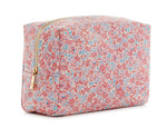The LUXE Everyday Cosmetic Bag, Marseille by TRVL Design is a rectangular vegan leather pouch featuring pink, red, and blue floral patterns on a light background with a gold zipper—perfect as a stylish toiletries organizer.