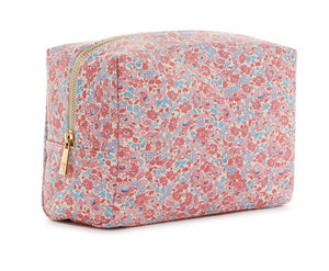 The LUXE Everyday Cosmetic Bag, Marseille by TRVL Design is a rectangular vegan leather pouch featuring pink, red, and blue floral patterns on a light background with a gold zipper—perfect as a stylish toiletries organizer.