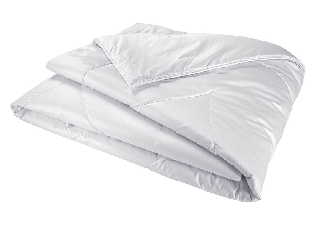 The Yves Delorme Mandarin Silk Comforter, featuring a smooth, quilted surface, is displayed against a plain white background.
