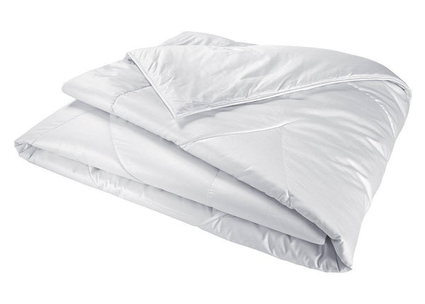 The Yves Delorme Mandarin Silk Comforter, by Yves Delorme, is a folded white comforter made from organic silk fibers with a quilted design and visible stitching.