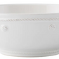 A white ceramic pasta bowl from Juliska’s Berry & Thread Classic Whitewash Dinnerware Collection, featuring a slightly flared rim with raised dot and rope-like patterns around the edge.