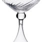 The Venetia Drinkware Collection by William Yeoward Crystal features a clear coupe with a textured bowl, elegant stem, and wide base, beautifully photographed against a plain white background.