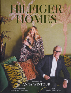 A woman in a patterned outfit sits on a green sofa behind a man in a suit; both are in a stylish, patterned room. Text reads "An Afternoon with Dee & Tommy Hilfiger at Hive" by HIVE, celebrating their book signing in West Palm Beach.
