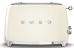 A white Smeg toaster with wide slots for different browning levels.