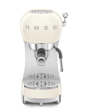 A cream-colored Smeg espresso machine from the SMEG Espresso Machine Collection, designed with a portafilter and steam wand, offers 15 bar pressure and an Adjustable Cappuccino system for perfect brews.