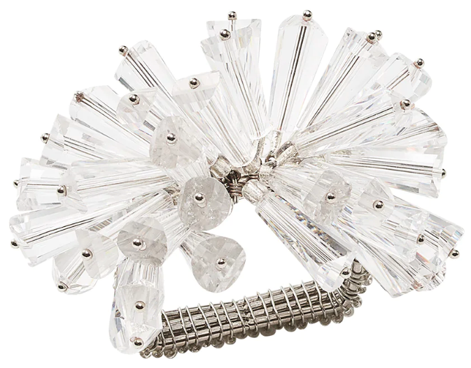 The Kim Seybert Dazzle Napkin Ring features a silver-toned design with multiple clear, fan-shaped faceted glass beads arranged in a clustered decorative pattern.