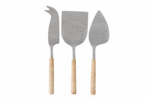 The Be Home Aquila Serving Collection features three handcrafted metal cheese knives with wooden handles, each with a unique blade shape—elegant pieces from India designed to elevate any cheese spread.