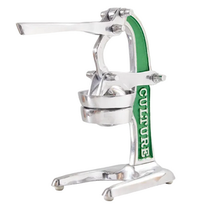 The Verve Culture Citrus Juicer is a metal juicer with a lever handle, perfect for any kitchen or mixing fresh cocktails, and features “CULTURE” printed vertically in green on the side.