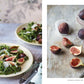 Two plates of arugula and fig salad on the left—an elegant nod to regional Italian cuisine inspired by Cucina Di Amalfi By Ursula Ferrigno from Simon & Schuster—while whole and halved figs with a knife and paper cups rest on the right, all arranged on rustic surfaces.