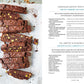 Sliced chocolate biscotti with pistachios rest on parchment paper beside a cup of milk, accompanied by recipe text for chocolate, fig, apricot, and pistachio biscotti from Cucina Di Amalfi By Ursula Ferrigno by Simon & Schuster—an inviting tribute to regional Italian cuisine and the rich heritage of Italian cooking.
