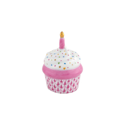 The Herend Cupcake with Candle is a hand-painted porcelain container featuring a pink base, white frosting with colored dots, and a gold-tipped candle—an ideal decorative accent for any room.