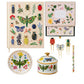 The Curio Desk Accessory Collection by Riffle Paper Co. features a notebook, greeting cards, paper clips, plate, lidded jar, and pen with vibrant bug and plant illustrations—ideal for garden lovers.