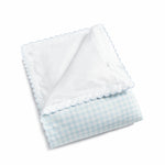The Gooselings Blue Picnic Gingham Bedding Collection features a folded, breathable baby blanket with a light blue gingham pattern and scalloped trim, made from pure materials, shown on a white background.