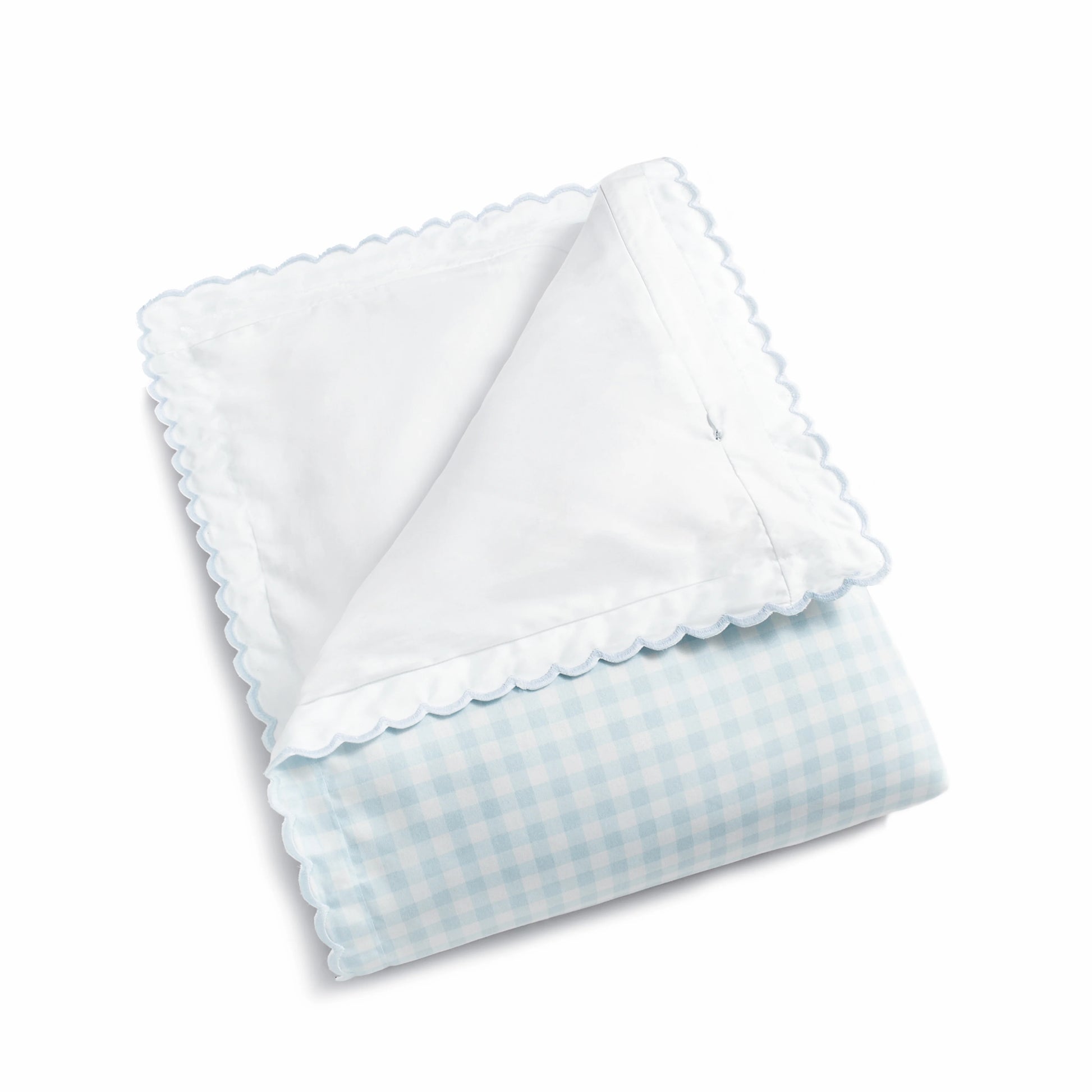 The Gooselings Blue Picnic Gingham Bedding Collection features a folded, breathable baby blanket with a light blue gingham pattern and scalloped trim, made from pure materials, shown on a white background.