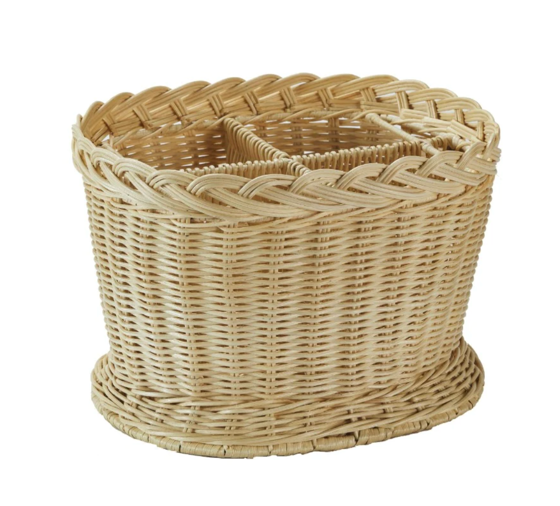 The Amanda Lindroth Rattan Wine Holder features a braided rim and four compartments for stylish wine storage—a handcrafted wicker piece shown on a white background.