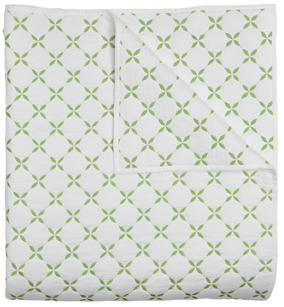 The John Robshaw Layla Coverlet, Leaf is a quilt made from soft cotton voile, featuring a white background with a repeating green geometric pattern inspired by Mughal gardens.