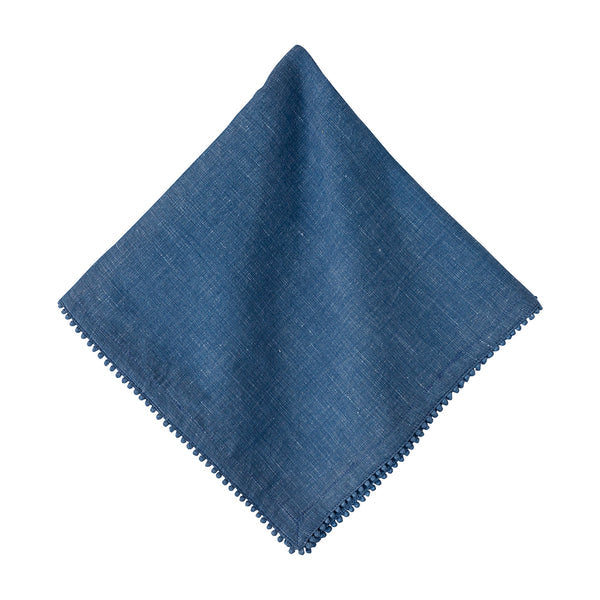 The Berry Trim Napkin Collection by Juliska features a square blue woven cotton napkin with subtle texture and decorative edging, shown flat on a white background.