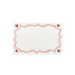 A rectangular white card with a pink wavy border and red hearts, inspired by the Love You More Decor and Tabletop Collection from Juliska.