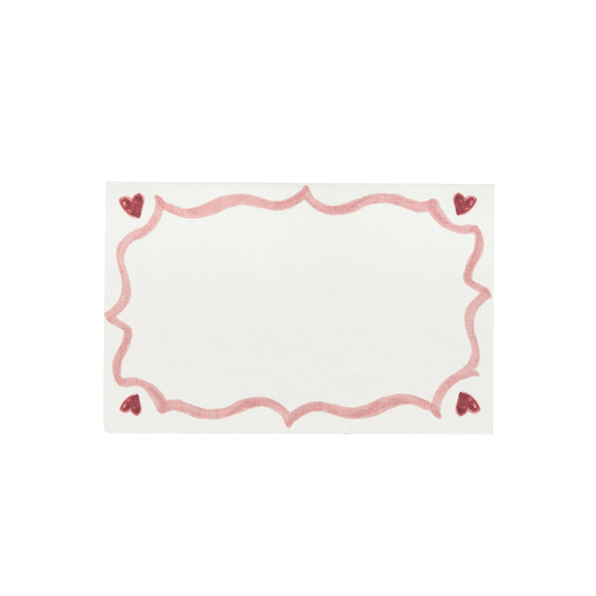 A rectangular white card with a pink wavy border and red hearts, inspired by the Love You More Decor and Tabletop Collection from Juliska.