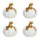 Four small pumpkins from Juliska’s Forest Walk Tabletop Collection, featuring gold stems and tops, are arranged in a grid on a white background—ideal as napkin rings or unique place card holders.
