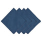 Four navy blue napkins from Juliska’s Berry Scallop Napkin & Tablecloth Collection are arranged in an overlapping row on a white background, evoking the look and feel of the brand’s woven linen tablecloths.