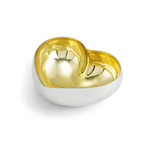 A small, heart-shaped dish from the Gold Heart Dish Collection by Michael Aram features a shiny silver exterior with a reflective gold interior, beautifully presented against a white background.