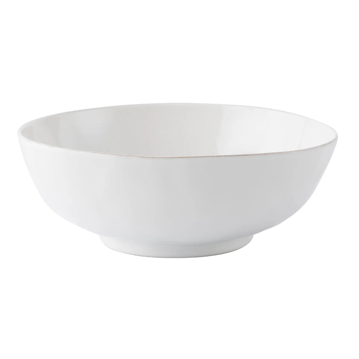 The Juliska Puro Whitewash 10" Serving Bowl is a ceramic bowl with a wide rim and slightly raised base, displayed on a white background.