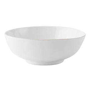 The Juliska Puro Whitewash 10" Serving Bowl is a ceramic bowl with a wide rim and slightly raised base, displayed on a white background.