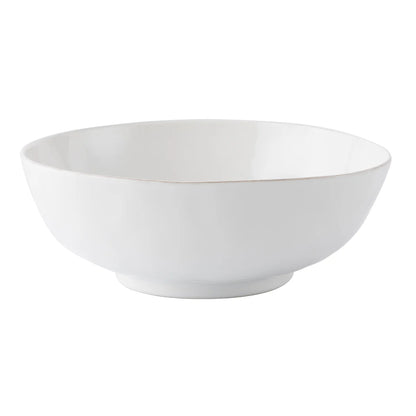The Juliska Puro Whitewash 10" Serving Bowl is a ceramic bowl with a wide rim and slightly raised base, displayed on a white background.