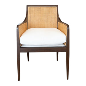 A modern cane chair inspired by the Wallace Chair, featuring a beech frame with a dark brown finish, cane back and sides, and a white cushioned seat—shown from the front. From Hickory Chair.
