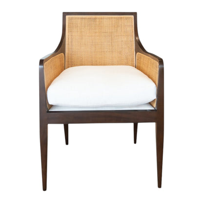 A modern cane chair inspired by the Wallace Chair, featuring a beech frame with a dark brown finish, cane back and sides, and a white cushioned seat—shown from the front. From Hickory Chair.